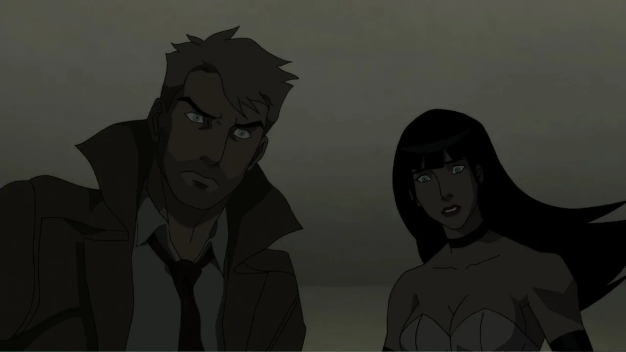 Justice League Dark (2017) movie still: medium — A dimly lit interior space provides the backdrop for two standing figures. A man and a woman in…