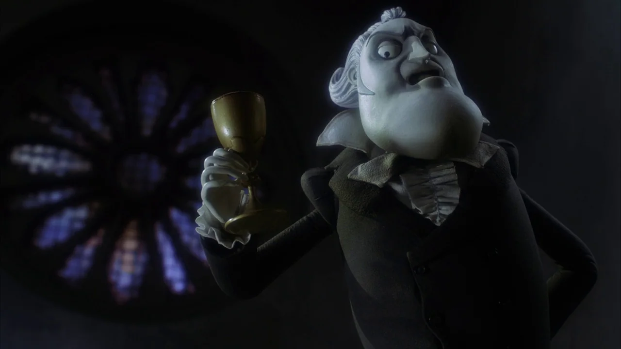 The Corpse Bride (2005) movie still: medium — A dark, dimly lit stone interior features a large circular stained-glass window in the background. An…