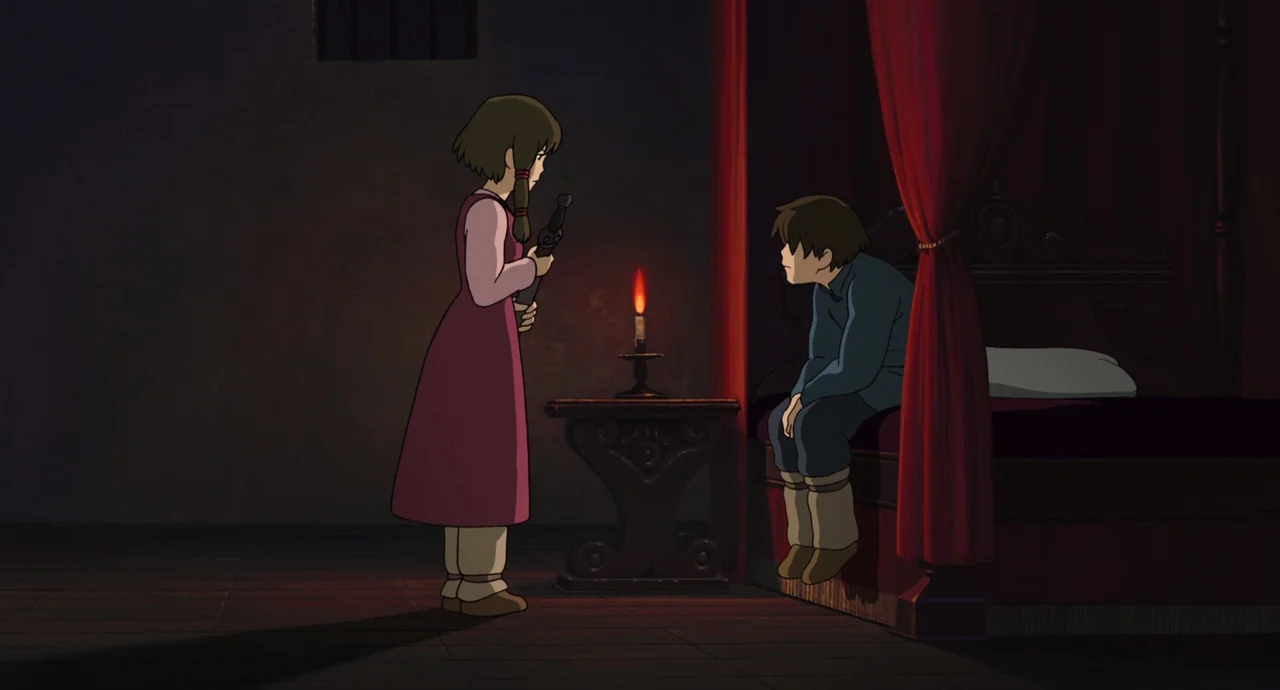 Tales From Earthsea (2006) movie still: wide — A dim room contains a large bed with red curtains and a wooden table. A girl holds a sword while a…