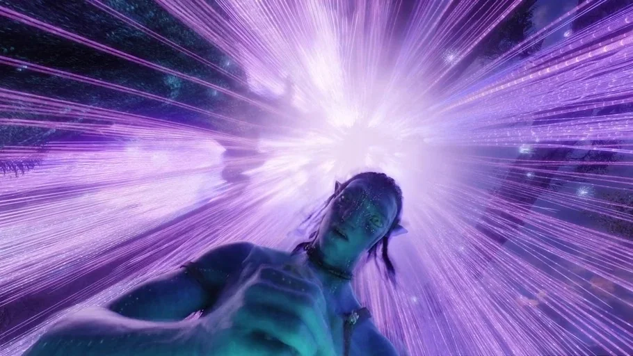 Avatar (2009) movie still: medium — A blue-skinned alien stands in an environment filled with streaks of purple light. The figure looks directly…