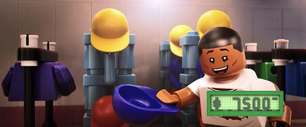 Piece by Piece (2024) movie still: medium — A plastic brick-built locker room contains rows of cubbies and colored clothing items. A male lego…