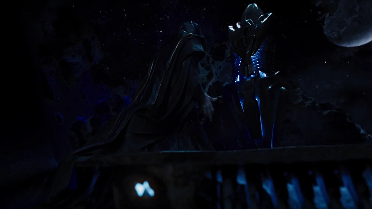 The Avengers (2012) movie still: medium — A dark, rocky alien landscape features a star-filled sky and a large glowing moon. A hooded figure stands…