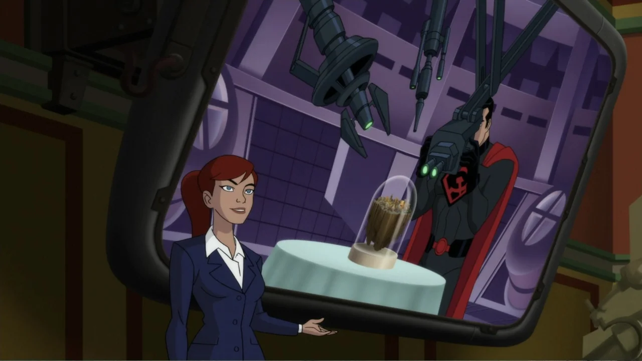 Superman: Red Son (2020) movie still: medium — A woman stands in a broadcast studio in front of a large flat screen. The screen displays a male…