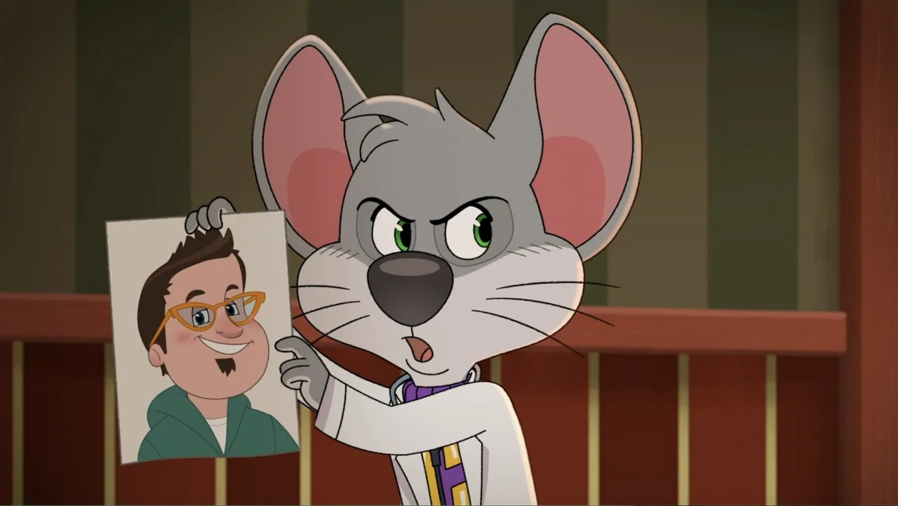 A Chuck E. Cheese Christmas (2025) movie still: medium — A mouse character stands in front of a wood paneled wall. The character holds up a cartoon…