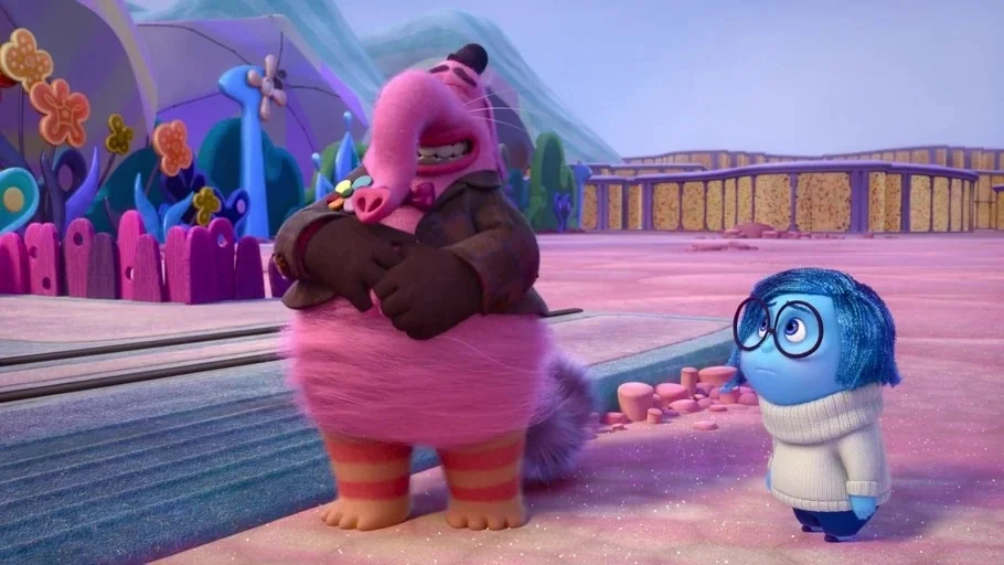 Inside Out (2015) movie still: fullbody — An abstract, candy-colored environment with stylized floral structures and a curved ground path. A large…