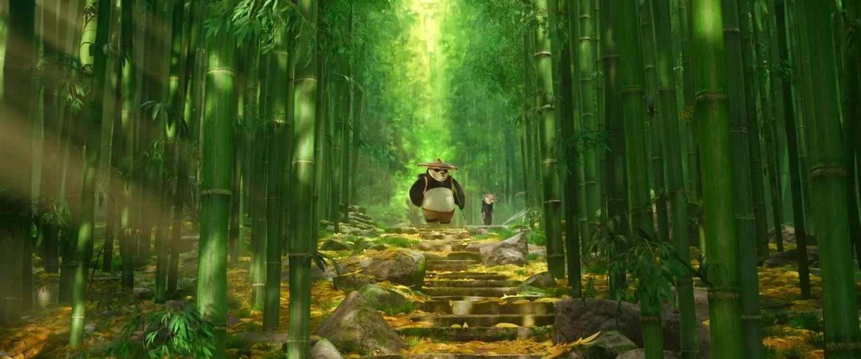Kung Fu Panda 4 (2024) movie still: wide — A dense bamboo grove features tall green stalks and a central stone staircase. A panda and a fox walk up…