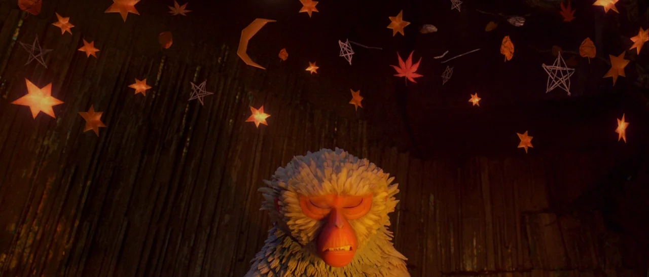 Kubo and the Two Strings movie still: medium — A dark, wood-textured enclosure features numerous hanging paper stars and autumn leaves. A…
