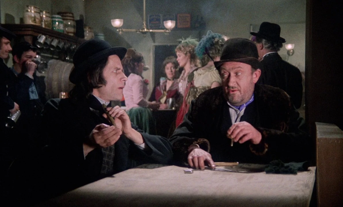 Dr Jekyll & Sister Hyde (1971) movie still: medium — A crowded 19th-century public house features wooden furniture and several patrons in the…