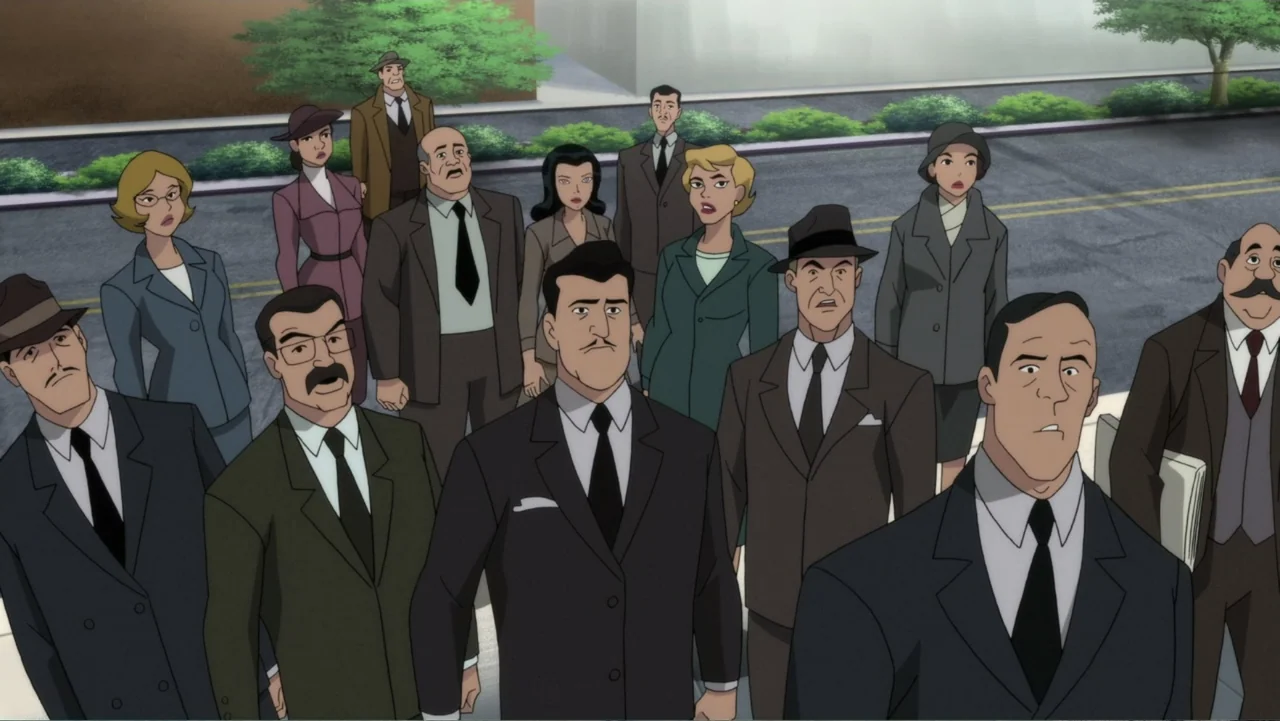 Superman: Red Son (2020) movie still: medium — A city street crowded with a group of people dressed in 1950s formal business suits. The men and…
