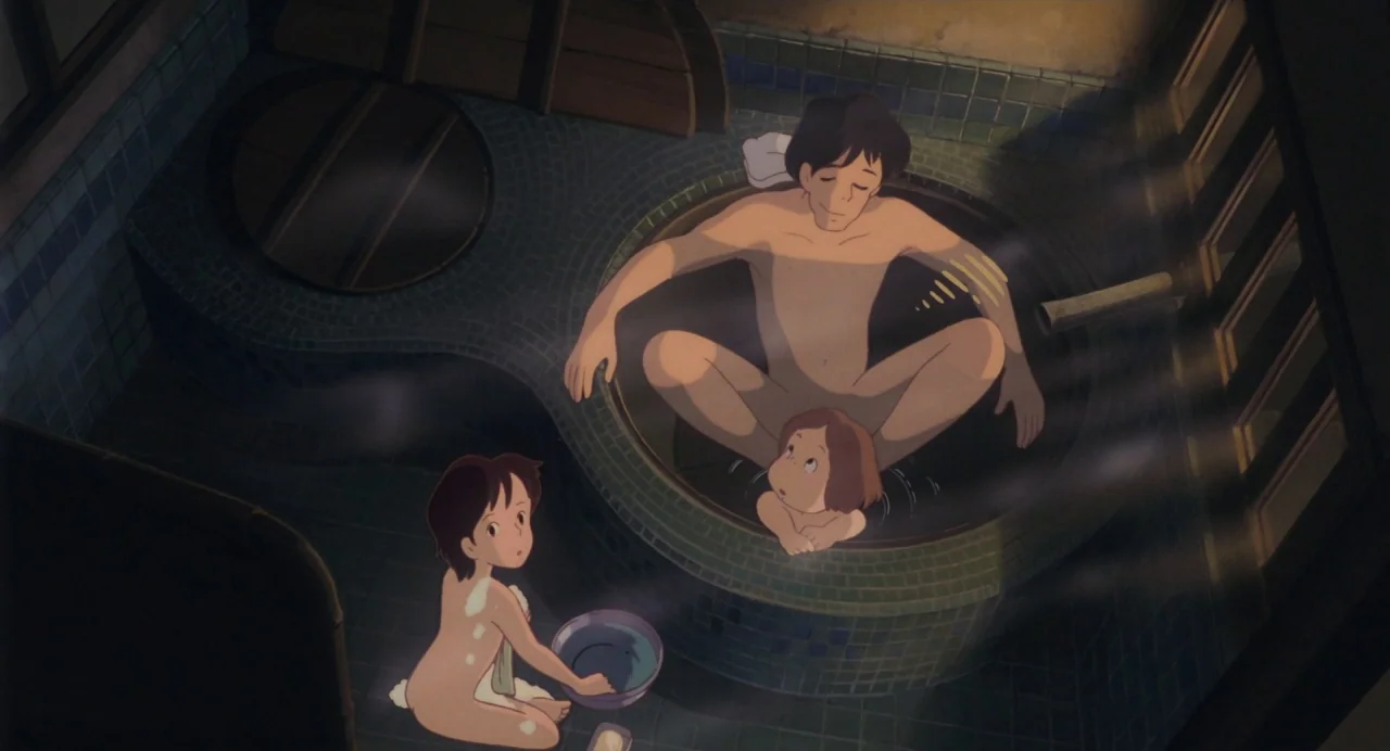 My Neighbour Totoro (1988) movie still: wide — A traditional Japanese bathroom features a round tiled soaking tub and blue mosaic floor tiles. An…