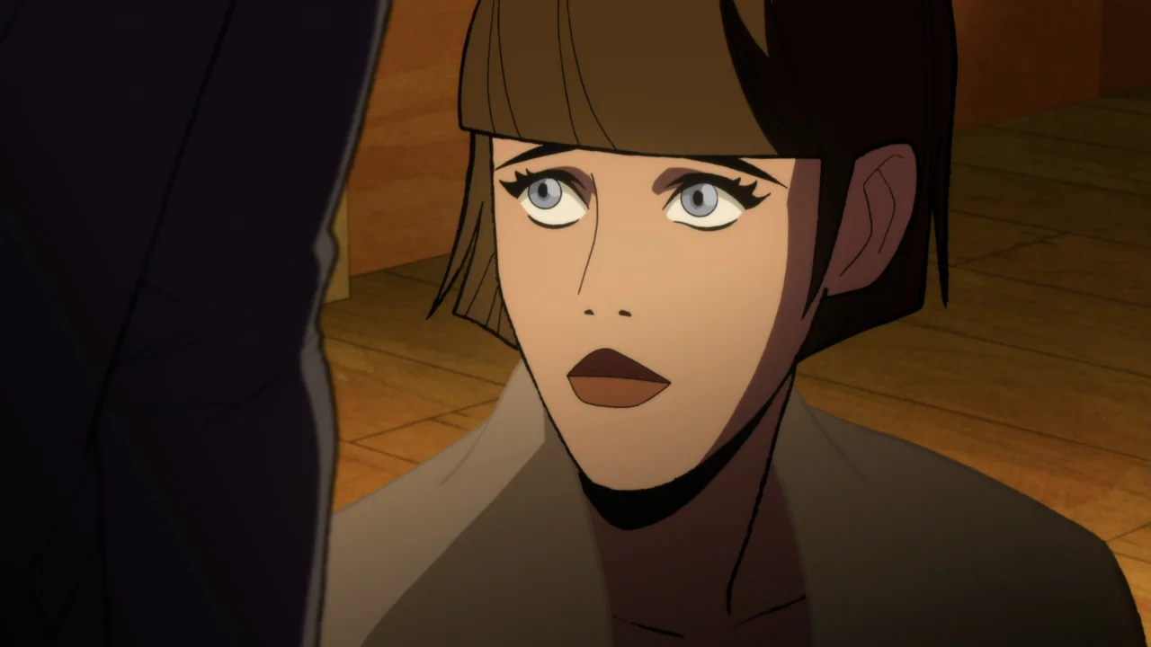 Batman: The Long Halloween, Part One (2021) movie still: closeup — An interior space features wood plank flooring and a woman in the foreground. A…