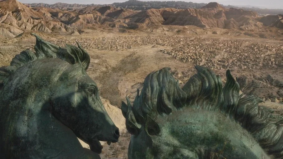 Game of Thrones: The Last Watch (2019) movie still: establishing — An arid desert valley features a sprawling village settlement surrounded by…