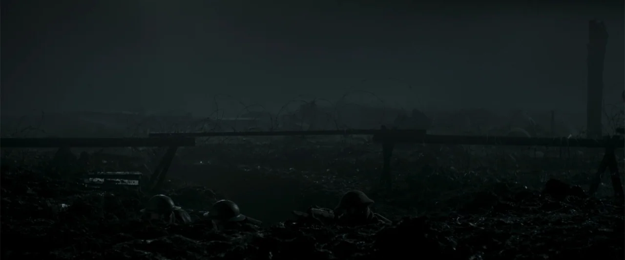 Gone Missing -  Old John's Final Journey (2014) movie still: wide — A dark muddy battlefield at night featuring barbed wire on a wooden barrier.…