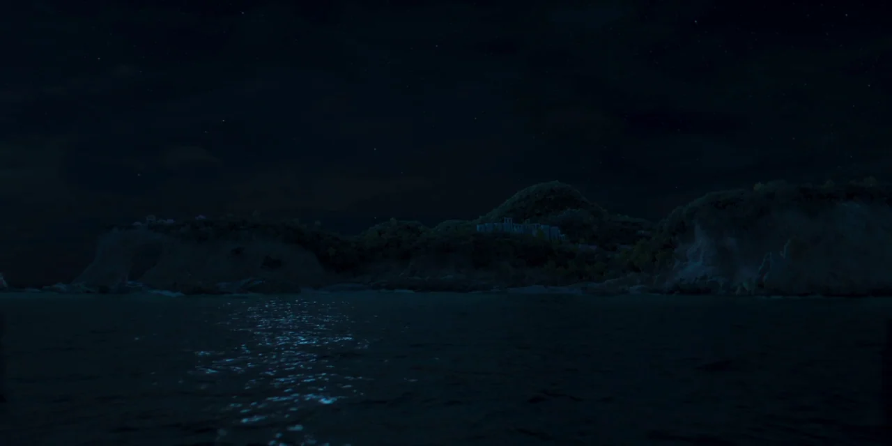 Paradise Hills (2019) movie still: establishing — A dark, rocky coastline stretches across the frame beneath a starry night sky. The calm ocean…
