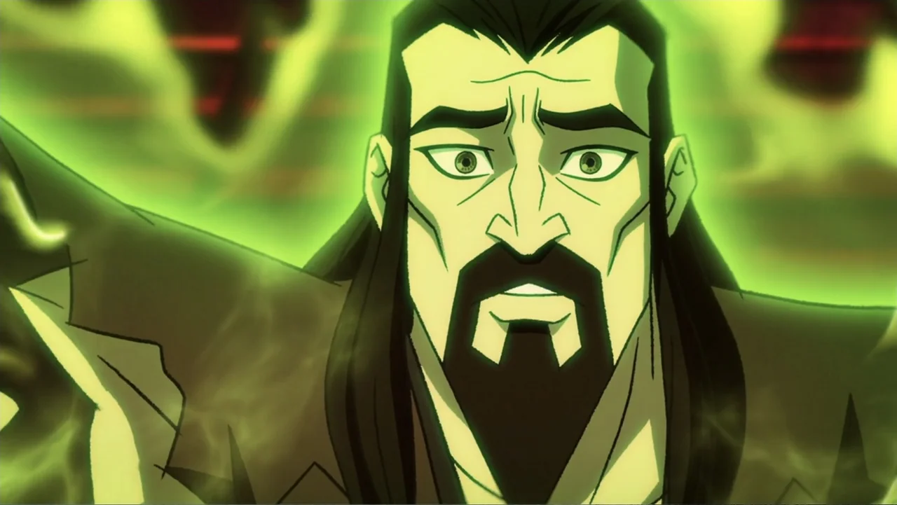 Mortal Kombat Legends: Snow Blind (2022) movie still: closeup — A man stands in a space filled with thick, swirling green magical energy. He gazes…