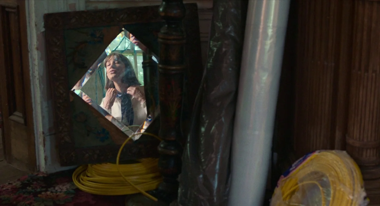 Where’d You Go Bernadette (2019) movie still: medium — A cluttered room under renovation contains construction materials and a vintage wall mirror.…