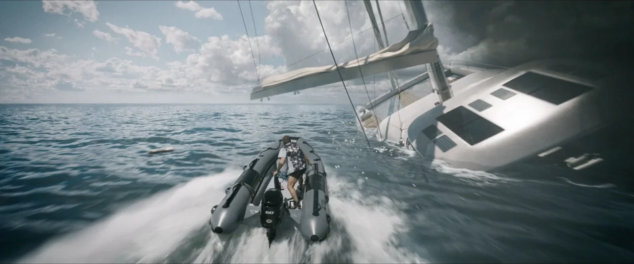 Road House (2024) movie still: wide — A man drives a small inflatable motorboat through choppy sea water near a sinking yacht. The large sailboat is…