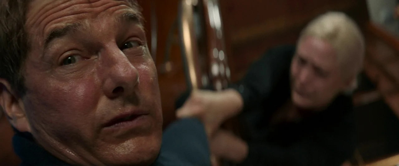 Mission: Impossible – Dead Reckoning Part One (2023) movie still: closeup — An interior space with warm wood paneling, likely the hull of a vessel.…