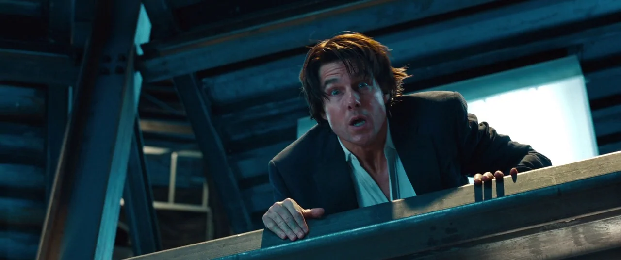 Mission: Impossible – Ghost Protocol (2011) movie still: medium — A dark industrial catwalk features exposed steel beams and heavy metal structural…