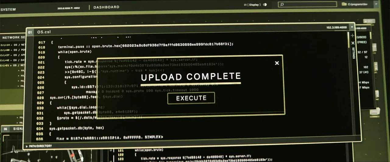 Heads of State (2025) movie still: closeup — A digital computer terminal interface displays lines of source code and a status window. The centered…