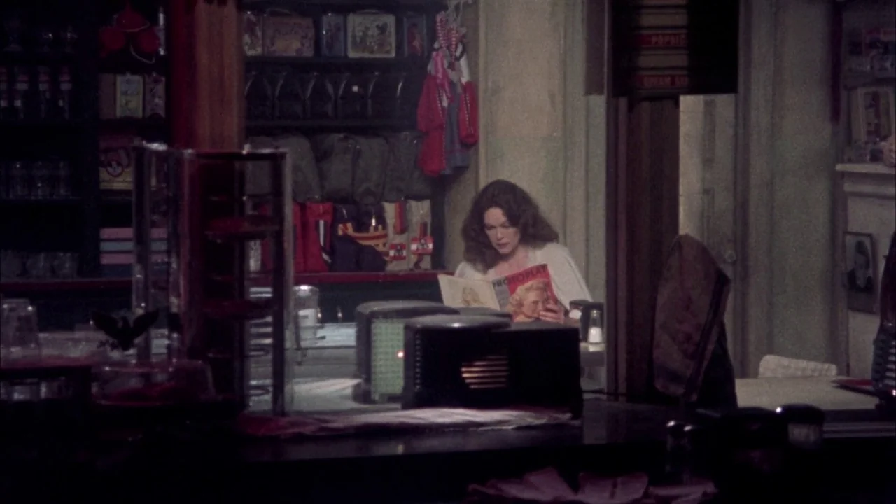 Come Back to the 5 & Dime Jimmy Dean, Jimmy Dean (1982) movie still: medium — A dark diner interior with shelves filled with various boxes and bags…