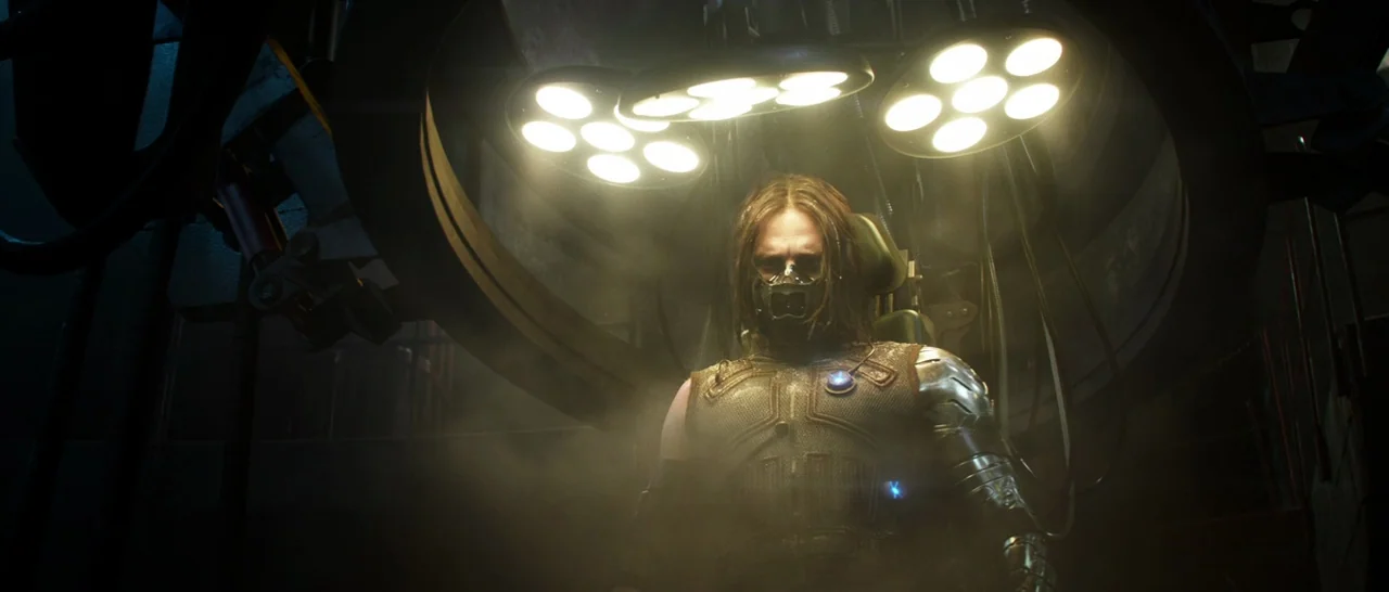 Captain America: Civil War (2016) movie still: medium — A dark industrial laboratory filled with thick haze and large metallic machinery overhead. A…