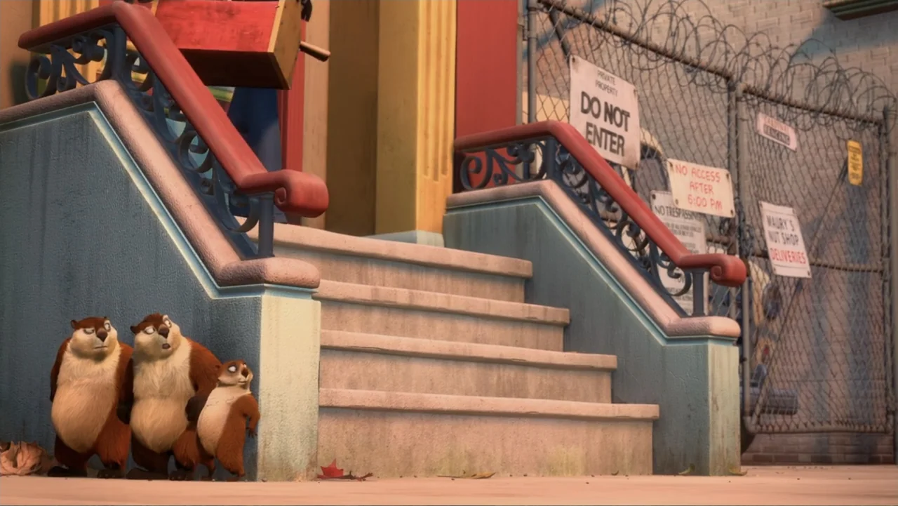 The Nut Job (2014) movie still: medium — Concrete steps lead up to a building entrance with a metal security fence nearby. Three small cartoon…