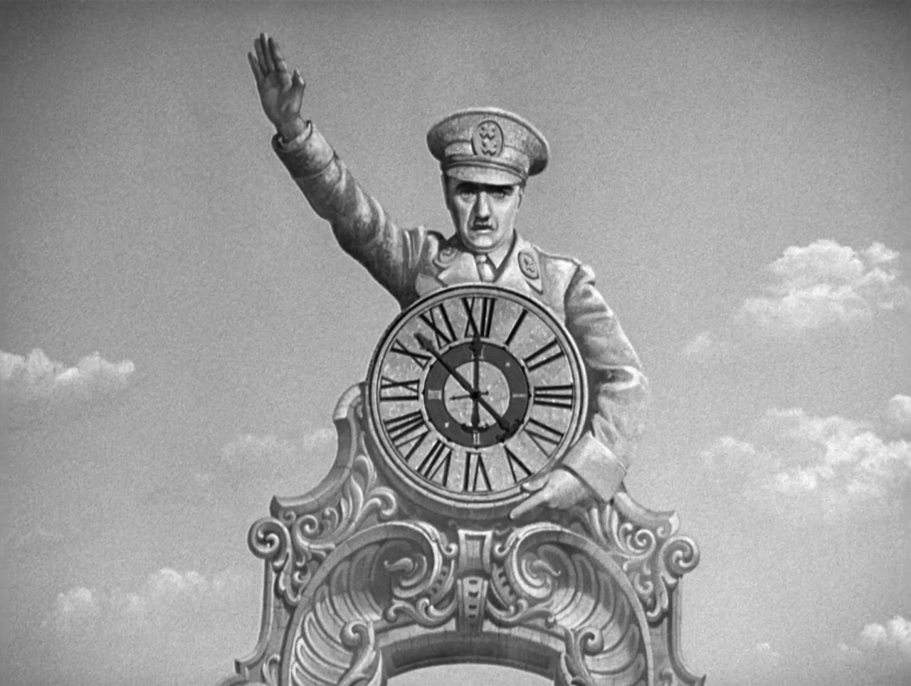 The Great Dictator (1940) movie still: medium — A man in military dress stands positioned behind a large, ornate stone clock face. The clock is set…
