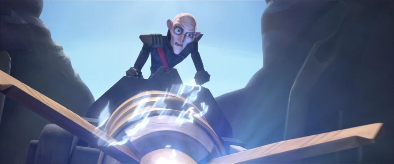 LEGO DC Super Hero Girls: Super-Villain High (2018) movie still: medium — A bald man stands behind a complex mechanical device between two dark rock…
