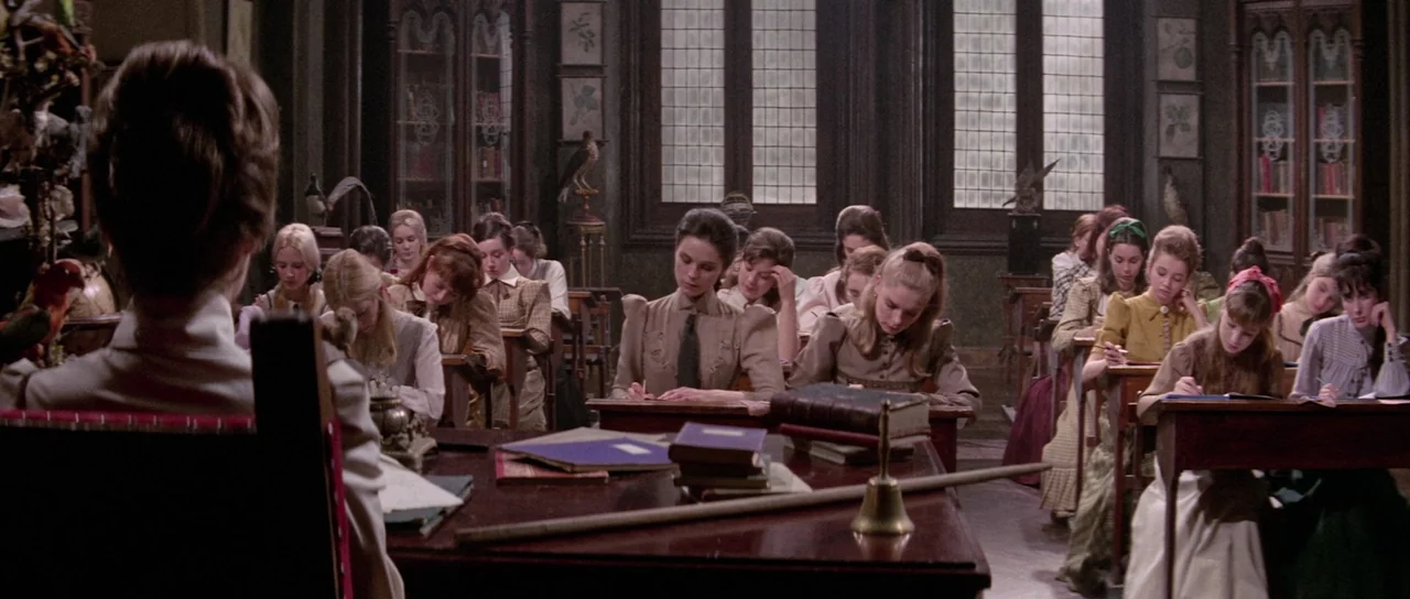 The House That Screamed (1969) movie still: wide — A late 19th-century school classroom features rows of students at wooden desks and leaded…