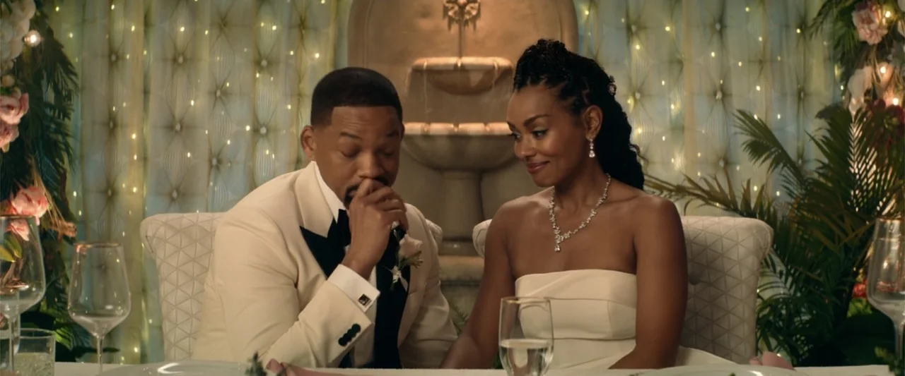 Bad Boys: Ride or Die (2024) movie still: medium — A decorated indoor reception space features a stone water fountain backdrop with floral…