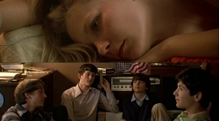The Virgin Suicides (1999) movie still: medium — A dimly lit 1970s living room features wooden furniture and an American flag. Four young men sit…