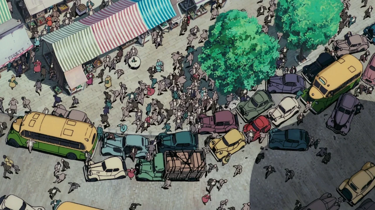 Kiki’s Delivery Service (1989) movie still: establishing — A bustling market square features striped stalls and numerous vintage automobiles…