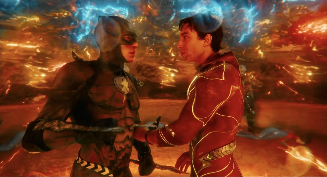The Flash (2023) movie still: medium — A surreal glowing realm filled with swirling golden light and streaks of electric blue. Two figures in…