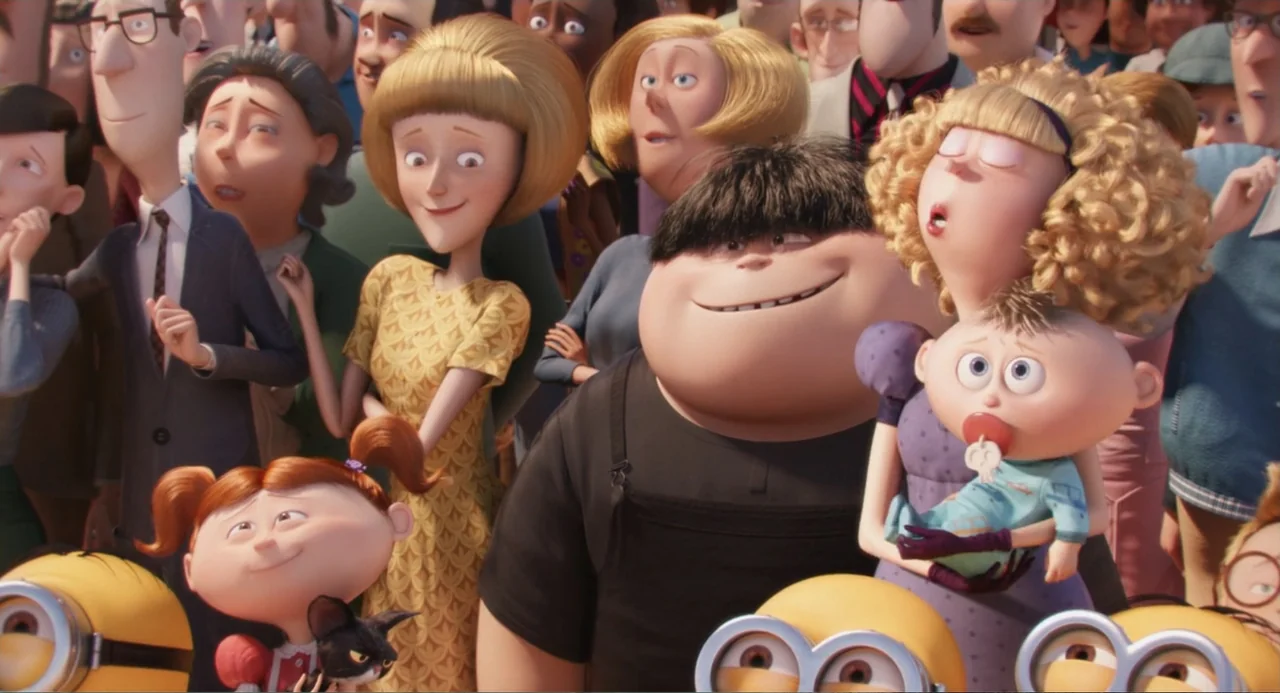 Minions (2015) movie still: medium — A diverse crowd of animated characters stands together in a bright outdoor public setting. Several adults and…
