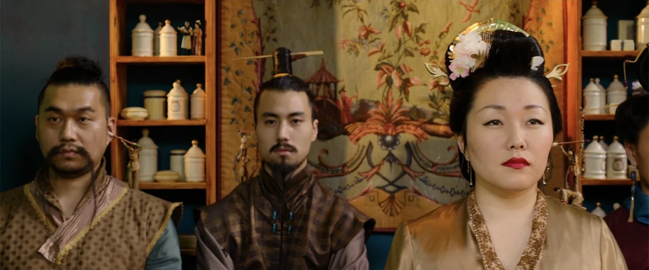 Jim Button and Luke the Engine Driver (2018) movie still: medium — An interior wall features wooden shelves filled with white ceramic jars and a…