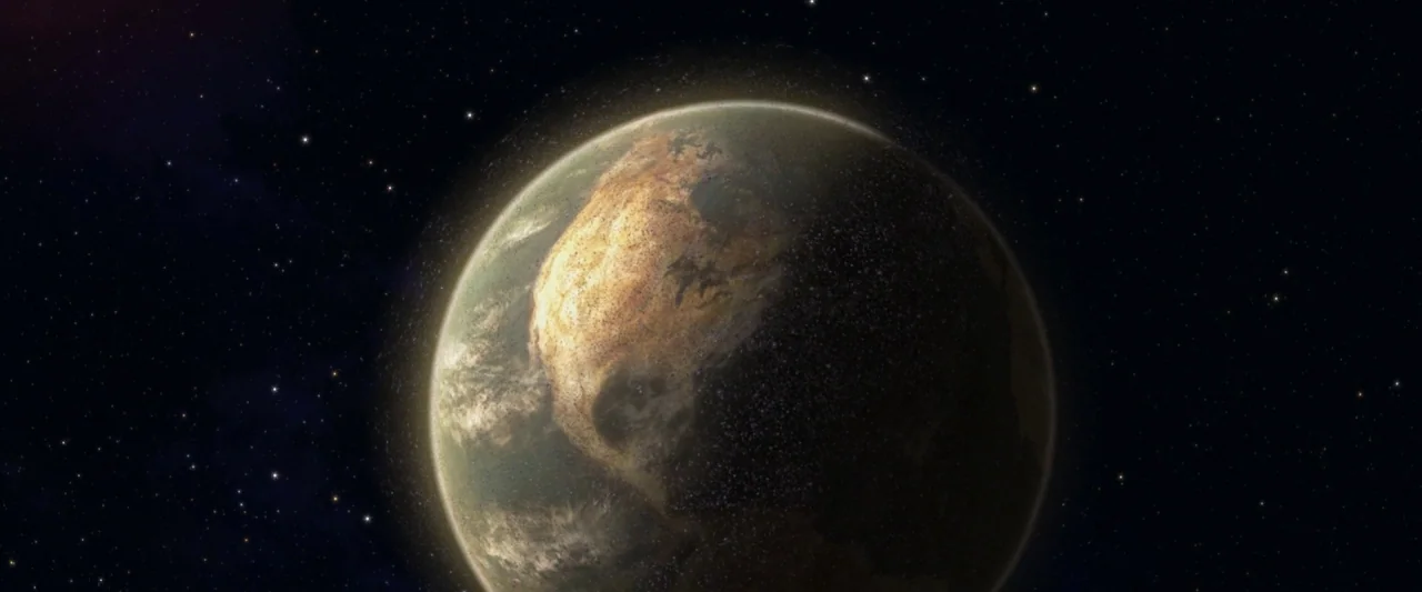 Wall-E (2008) movie still: establishing — A view from space shows the North American continent illuminated on a dusty planet. The dark side of the…