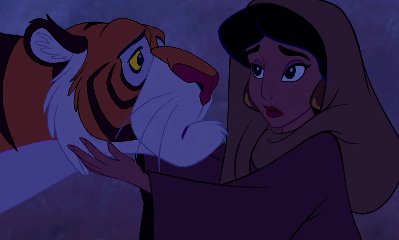Aladdin (1992) movie still: medium — A dark, purple-hued landscape at night serves as the setting for the pair. A woman in a brown cloak cradles the…