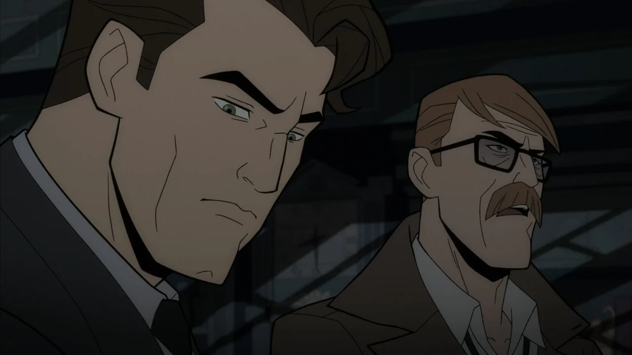 Batman: The Long Halloween, Part Two (2021) movie still: medium — Two men stand in a dark, stylized room with geometric architectural lines in…