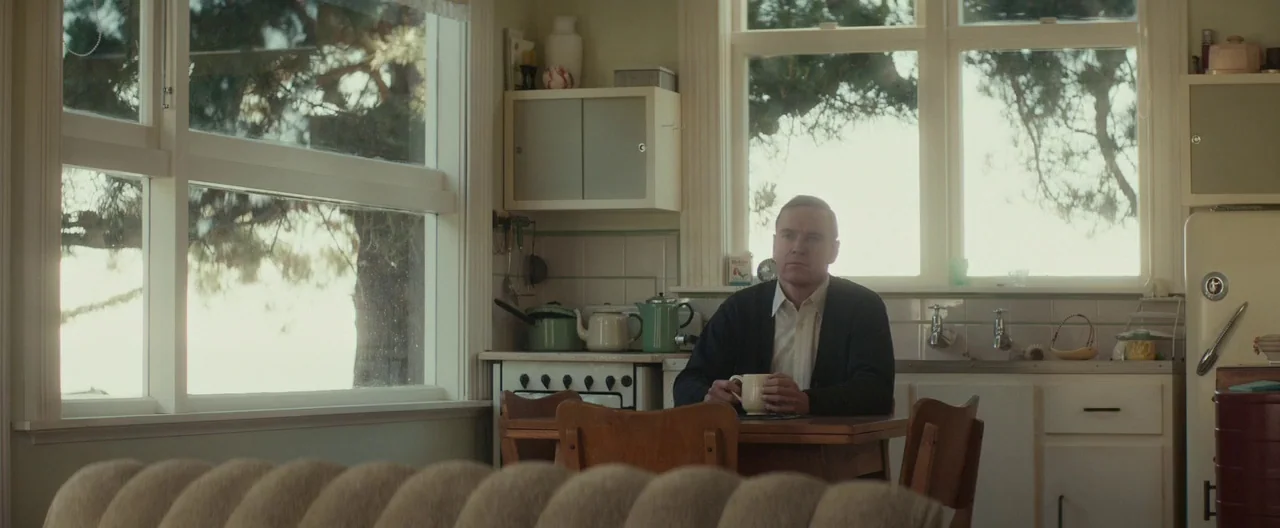 The Light Between Oceans (2016) movie still: medium — A vintage-style room features white cabinetry, tiled walls, and large windows with outdoor…