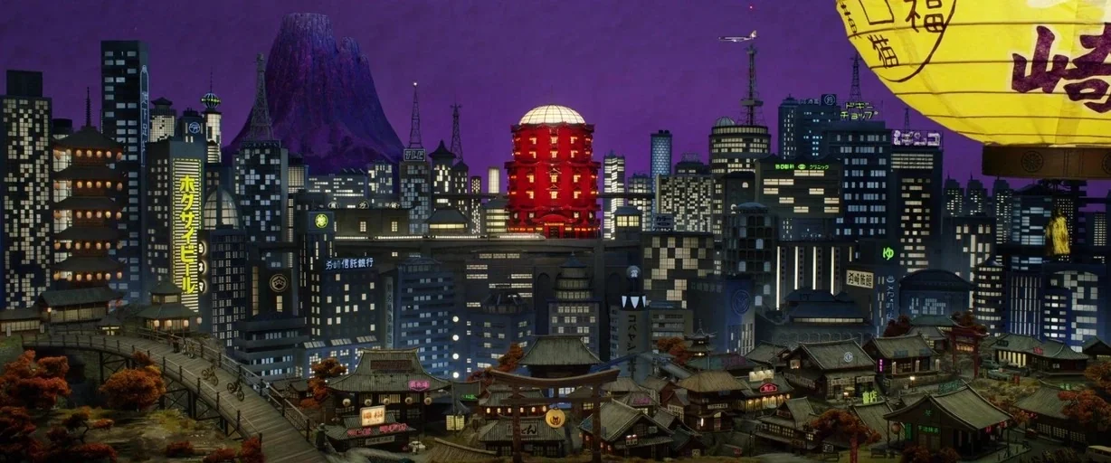 Isle of Dogs (2018) movie still: establishing — An stylized miniature Japanese cityscape features a dark purple sky and a large volcano. Numerous…