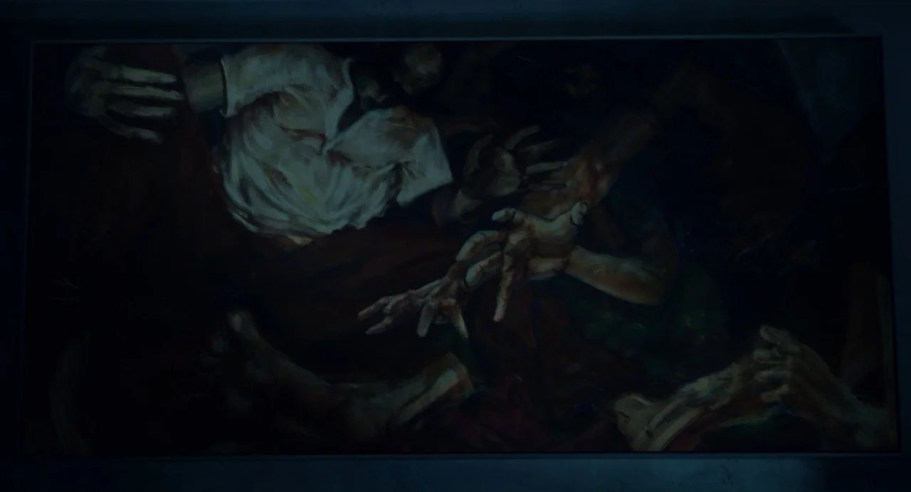 Velvet Buzzsaw (2019) movie still: closeup — A rectangular oil painting mounted on a dark, dimly lit wall. The artwork portrays a cluster of…