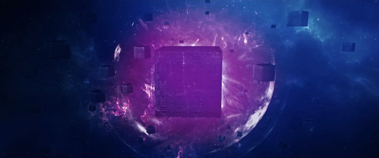 2036 Origin Unknown (2018) movie still: wide — A large metallic cube floats in deep space amidst swirling purple nebular gases. Multiple smaller…