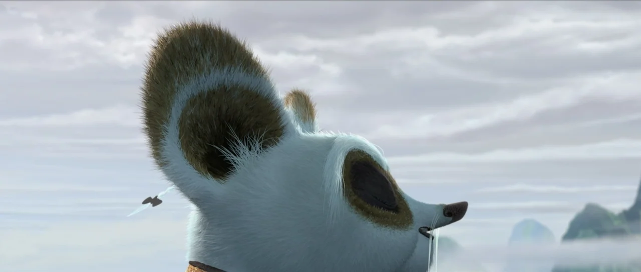 Kung Fu Panda 2 (2011) movie still: closeup — A furry white creature is seen in profile against a backdrop of distant mountains. The character has…