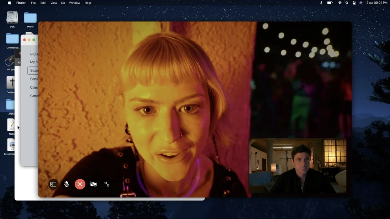 Resurrected (2023) movie still: closeup — A desktop computer interface displays a video call between a woman and a man. The woman occupies the main…