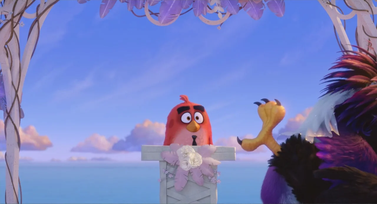 The Angry Birds Movie 2 (2019) movie still: medium — An outdoor wedding altar overlooks a blue ocean beneath a bright sky. A red bird stands behind…