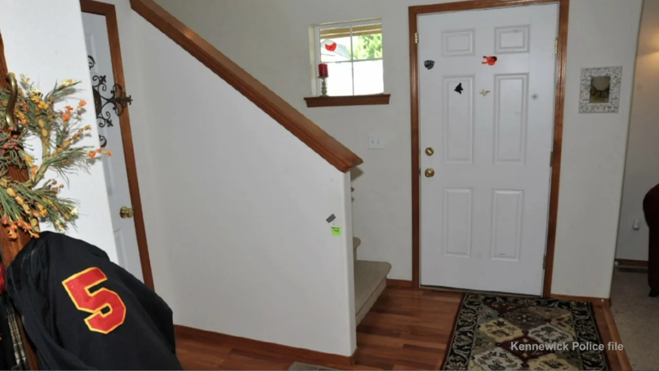 Requiem for the Dead: American Spring 2014 (2015) movie still: wide — A residential entryway features a white front door and a staircase with wooden…