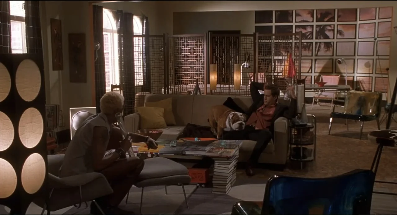 National Lampoon's Van Wilder (2002) movie still: medium — A modern furnished apartment features a low beige couch and a patterned room divider…