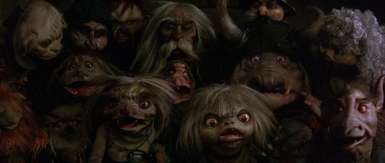 Labyrinth (1986) movie still: medium — A dimly lit, claustrophobic subterranean space filled with various grotesque, animatronic-style fantasy…