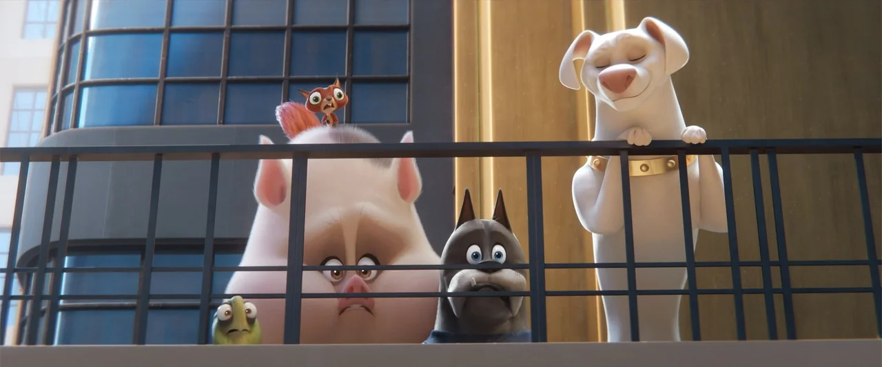 DC League of Super-Pets (2022) movie still: medium — A high-rise balcony with a black metal railing overlooks a city building facade. A group of…